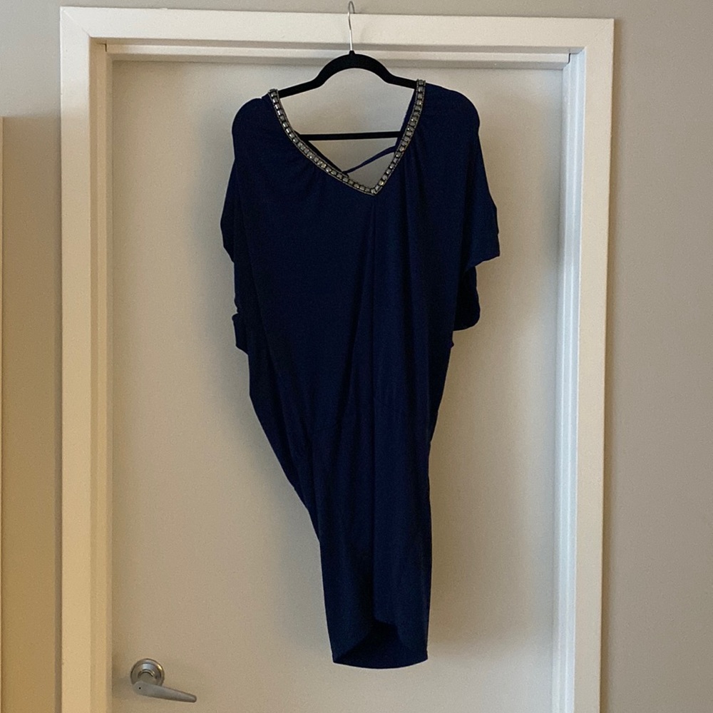 Navy blue Moda International dress with a beaded neck line and sleeves.